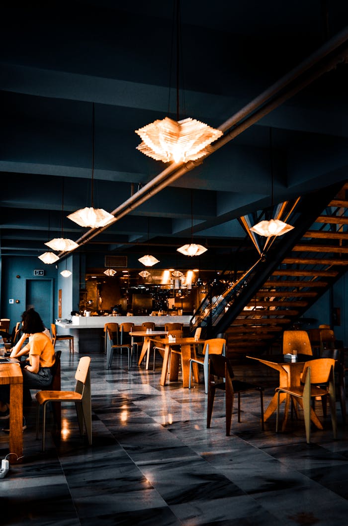 Elegant modern café with warm lighting and contemporary decor, creating a cozy atmosphere.